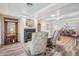 Spacious living room with hardwood floors, fireplace, and adjoining dining area at 316 Cedar Ln, Largo, FL 33770