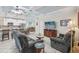 Open concept living room and kitchen with recessed lighting, modern furniture, and a ceiling fan at 316 Cedar Ln, Largo, FL 33770