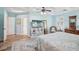 Bright and open main bedroom featuring wood floors, stylish furniture, and plenty of natural light at 316 Cedar Ln, Largo, FL 33770