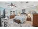 Spacious main bedroom with a ceiling fan, wood flooring, and plenty of natural light at 316 Cedar Ln, Largo, FL 33770