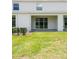 A covered patio overlooks a lush green backyard at 33063 Tulip Petal Ln, Wesley Chapel, FL 33545