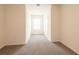 Bright, carpeted bedroom with neutral walls and window providing natural light at 33063 Tulip Petal Ln, Wesley Chapel, FL 33545