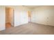 This is a bedroom with doors to the bathroom and carpet flooring at 33063 Tulip Petal Ln, Wesley Chapel, FL 33545