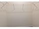 Empty closet with white wire shelving, ready for storage and organization at 33063 Tulip Petal Ln, Wesley Chapel, FL 33545