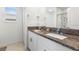 Elegant bathroom with double sinks and granite countertops at 36412 Garden Wall Way, Zephyrhills, FL 33541
