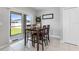 Cozy dining area with sliding glass doors to the backyard and a modern tile floor at 36412 Garden Wall Way, Zephyrhills, FL 33541