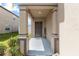 Front entrance with pillars, a decorative 'welcome' sign and minimal landscaping at 36412 Garden Wall Way, Zephyrhills, FL 33541