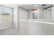 Bright and airy hallway showcasing the upper level of the home at 36412 Garden Wall Way, Zephyrhills, FL 33541