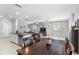 Open-concept kitchen and living area with lots of natural light and modern finishes at 36412 Garden Wall Way, Zephyrhills, FL 33541