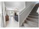 Inviting living room with tile flooring and staircase access at 36412 Garden Wall Way, Zephyrhills, FL 33541