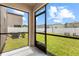 Screened patio featuring a view of the fenced backyard at 36412 Garden Wall Way, Zephyrhills, FL 33541