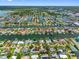 Breathtaking aerial view of waterfront neighborhood with canals, lush greenery, and houses with boat docks at 3944 49Th S Ave, St Petersburg, FL 33711