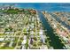 Stunning aerial view capturing a neighborhood with canals and houses with boat docks, and waterfront views at 3944 49Th S Ave, St Petersburg, FL 33711