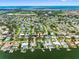 Picturesque aerial view of a neighborhood with canals and houses with boat docks, and waterfront views at 3944 49Th S Ave, St Petersburg, FL 33711