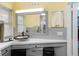 Bathroom featuring decorative mirror, vessel sink, and modern fixtures at 3944 49Th S Ave, St Petersburg, FL 33711