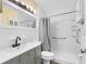 Bathroom featuring a shower-tub combination and vanity with sink and updated fixtures at 3944 49Th S Ave, St Petersburg, FL 33711