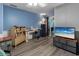Relaxing bedroom or office space with blue walls, modern desk, and light gray flooring at 3944 49Th S Ave, St Petersburg, FL 33711
