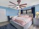 Comfortable bedroom features a fan and lots of natural light at 3944 49Th S Ave, St Petersburg, FL 33711