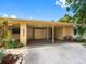 Charming single-story home with an attached carport and well-maintained landscaping and driveway at 3944 49Th S Ave, St Petersburg, FL 33711