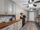 Charming kitchen featuring custom cabinets, butcher block countertops, and modern appliances at 3944 49Th S Ave, St Petersburg, FL 33711