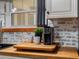Butcher block countertop area with a coffee maker and two mugs set near the window and sink at 3944 49Th S Ave, St Petersburg, FL 33711