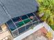 An aerial view of the outdoor, screened lanai with a rock garden and seating at 3944 49Th S Ave, St Petersburg, FL 33711