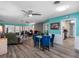 Bright living room featuring unique blue accents, a fireplace, and access to the lanai at 3944 49Th S Ave, St Petersburg, FL 33711