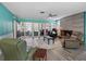 Inviting living room with a cozy fireplace and sliding doors to the outdoor patio at 3944 49Th S Ave, St Petersburg, FL 33711