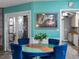Living room view highlighting an elegant table, open access to the kitchen, and lots of seating at 3944 49Th S Ave, St Petersburg, FL 33711