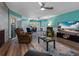 Bright living room features modern furnishings, stylish decor, and adjacent dining area at 3944 49Th S Ave, St Petersburg, FL 33711