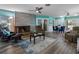 Spacious living room with a sleek fireplace and ceiling fans at 3944 49Th S Ave, St Petersburg, FL 33711