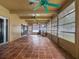 Enclosed patio featuring terra cotta tile, multiple ceiling fans, and ample light at 3944 49Th S Ave, St Petersburg, FL 33711