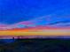 A picturesque sunset over a serene beach landscape, casting warm hues across the sky at 3944 49Th S Ave, St Petersburg, FL 33711