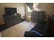 Casual bedroom with a sofa and dresser providing space for relaxation and storage at 4436 Horseshoe Pick Ln, Valrico, FL 33594