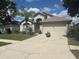Charming single-story home with well-maintained landscaping, neutral exterior, and attached two-car garage at 4436 Horseshoe Pick Ln, Valrico, FL 33594