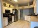 Bright kitchen features stainless steel appliances and an open layout at 4436 Horseshoe Pick Ln, Valrico, FL 33594