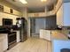 Bright kitchen features stainless steel appliances and an open layout at 4436 Horseshoe Pick Ln, Valrico, FL 33594