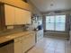 Eat-in kitchen features ample cabinet space and a large window at 4436 Horseshoe Pick Ln, Valrico, FL 33594