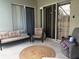 Outdoor patio features wicker furniture, ceiling fan, and sliding glass doors at 4436 Horseshoe Pick Ln, Valrico, FL 33594