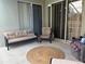 Outdoor patio features wicker furniture, ceiling fan, and sliding glass doors at 4436 Horseshoe Pick Ln, Valrico, FL 33594