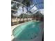 Backyard view of screened pool surrounded by a well maintained privacy fence at 4436 Horseshoe Pick Ln, Valrico, FL 33594