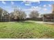 Spacious backyard featuring a well-kept lawn and a privacy fence at 4607 N Country Hills Ct, Plant City, FL 33566