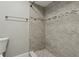 Bathroom showcasing tiled shower with modern fixtures and neutral color scheme at 4607 N Country Hills Ct, Plant City, FL 33566