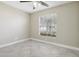 Comfortable bedroom features neutral walls, tile flooring, and natural light at 4607 N Country Hills Ct, Plant City, FL 33566