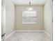 Cozy dining area with modern lighting fixture and view to the side yard at 4607 N Country Hills Ct, Plant City, FL 33566