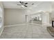 Open living room with tile flooring, high ceilings and view into the kitchen area at 4607 N Country Hills Ct, Plant City, FL 33566