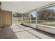 A screened lanai with a view of the yard at 4607 N Country Hills Ct, Plant City, FL 33566