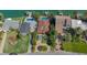 Aerial view of backyard featuring a circular driveway, and lush landscaping at 487 Harbor S Dr, Indian Rocks Beach, FL 33785
