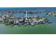 Waterfront home featuring a private dock and a swimming pool at 487 Harbor S Dr, Indian Rocks Beach, FL 33785