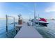 Dock with lifts for boat and jet ski, and scenic water views at 487 Harbor S Dr, Indian Rocks Beach, FL 33785